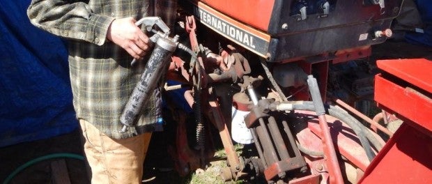 Greasing Tractors by Farmer Kristin